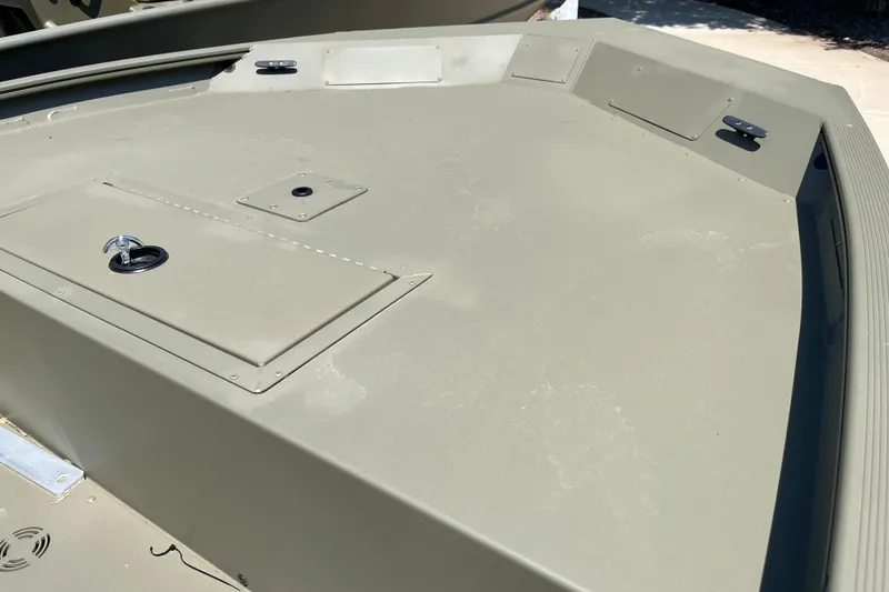 Slide: The Image of 2025 Tracker Grizzly 1754 Jon boat deck with storage compartments. - 4