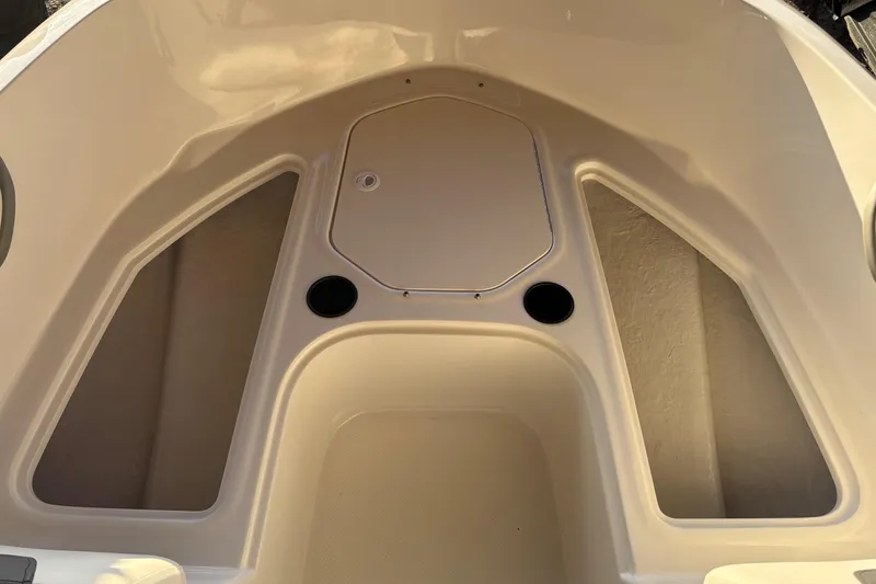 Slide: The Image of 2025 Bayliner E18LE boat interior with storage compartments. - 9
