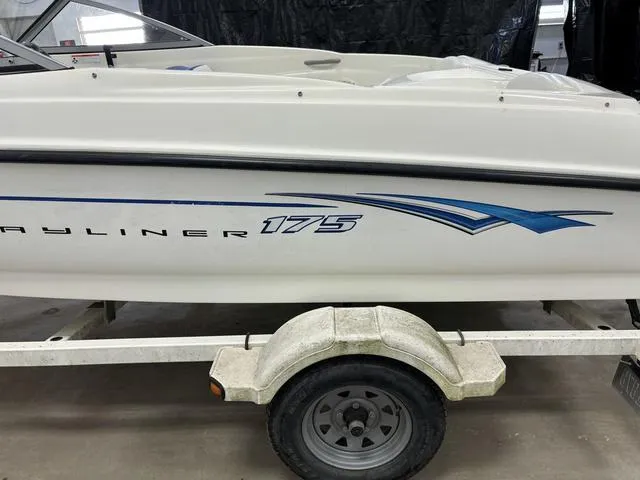 Slide: The Image of 2007 Bayliner 175 Bowrider on trailer, side view, white hull with blue graphics. - 10