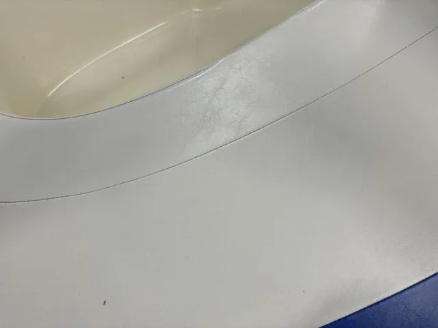 Slide: The Image of Close-up of 2007 Bayliner 175 Bowrider boat interior, featuring white and blue seating. - 15