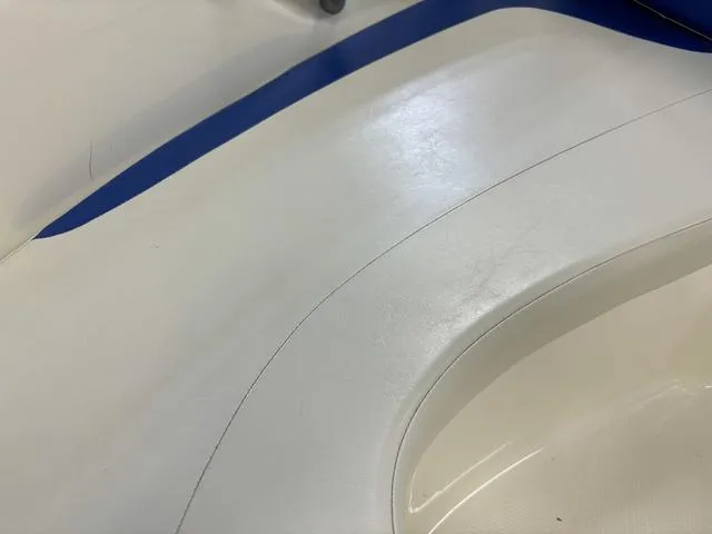 Slide: The Image of Close-up of 2007 Bayliner 175 Bowrider interior with white and blue seating. - 16