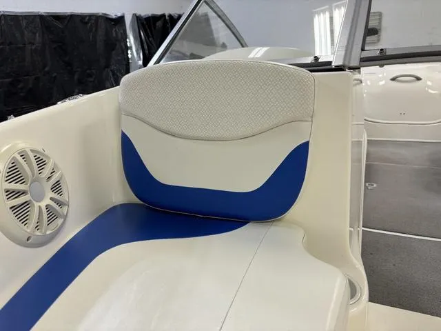 Slide: The Image of 2007 Bayliner 175 Bowrider interior with blue and white seating and speaker. - 18