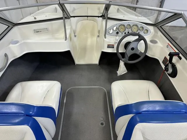 Slide: The Image of 2007 Bayliner 175 Bowrider interior with steering wheel and dual seats. - 19