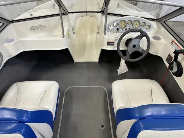 Slide: The Image of Interior of a 2007 Bayliner 175 Bowrider boat with steering wheel and seating. - 20