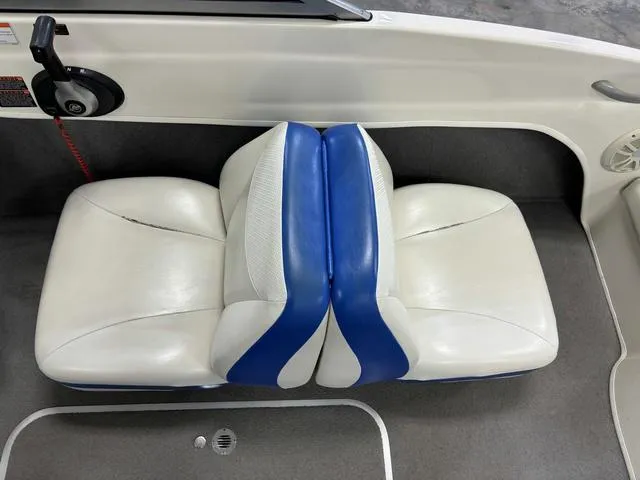 Slide: The Image of 2007 Bayliner 175 Bowrider interior with white and blue seats. - 27