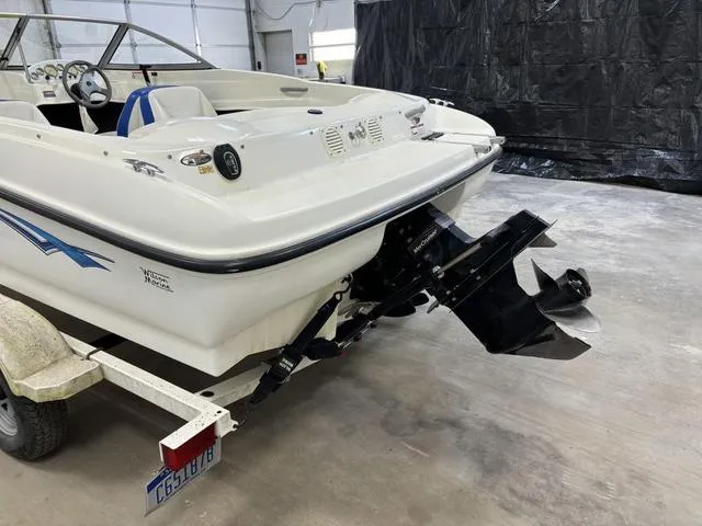 Slide: The Image of 2007 Bayliner 175 Bowrider on trailer in garage, rear view. - 8