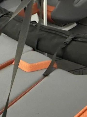 Slide: The Image of 2025 Scarab 195 LX boat on trailer, featuring sleek design and modern seating. - 11