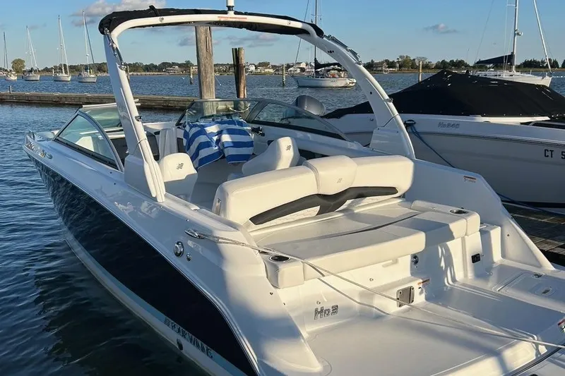 The Image of 2022 Four Winns HD3 OB RS boat docked in a marina. - 2