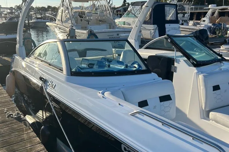 Slide: The Image of 2022 Four Winns HD3 OB RS boat docked at marina. - 6
