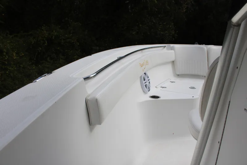 Slide: The Image of 2009 Sea Fox 256CC Pro Series boat interior with white seating and speaker. - 12