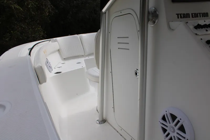 Slide: The Image of 2009 Sea Fox 256CC Pro Series boat interior with seating and storage. - 13