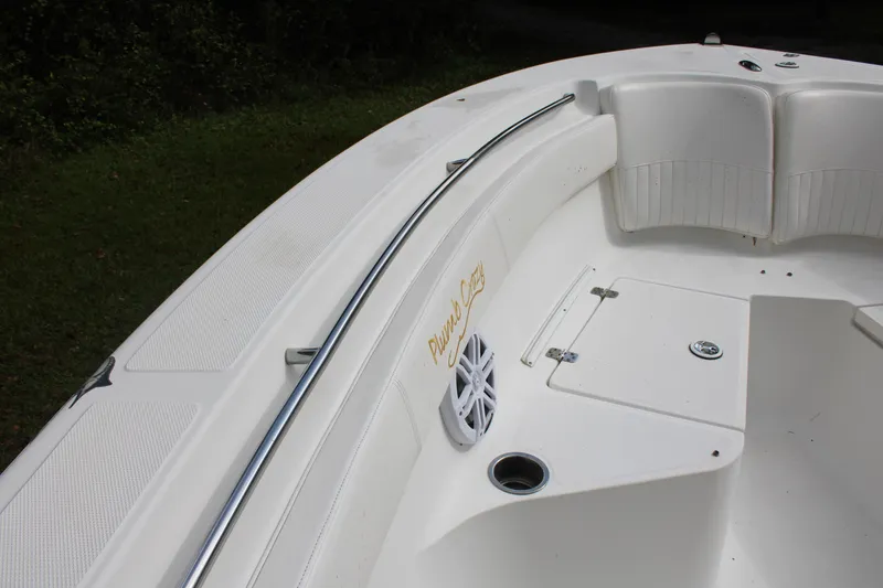 Slide: The Image of 2009 Sea Fox 256CC Pro Series boat interior, featuring seating and storage compartments. - 17