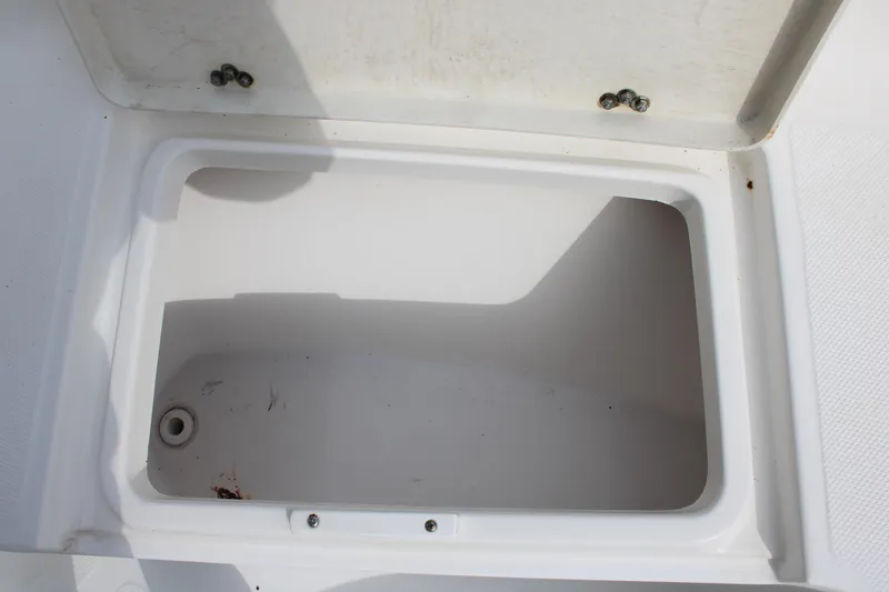 Slide: The Image of Open storage compartment on 2009 Sea Fox 256CC Pro Series boat. - 18