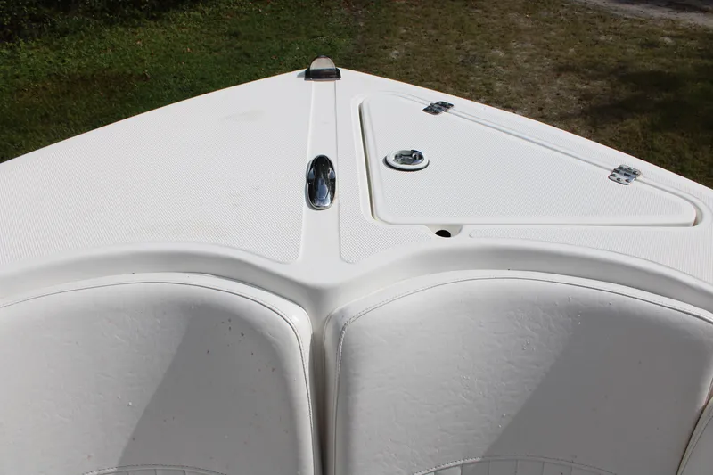 Slide: The Image of 2009 Sea Fox 256CC Pro Series boat deck, featuring storage compartments and sleek design. - 20