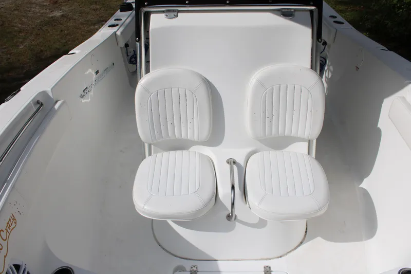 Slide: The Image of 2009 Sea Fox 256CC Pro Series boat with dual white seats. - 22