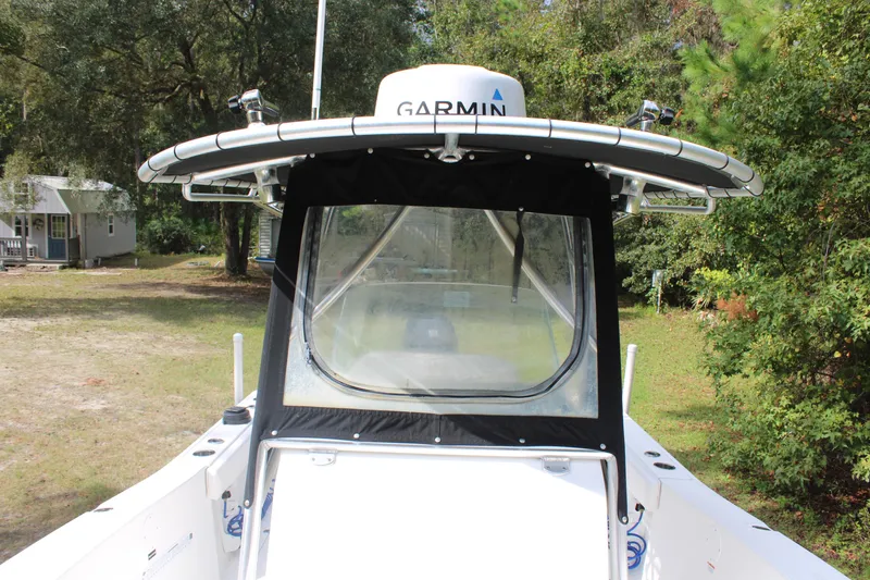 Slide: The Image of 2009 Sea Fox 256CC Pro Series boat with Garmin equipment, parked outdoors. - 24