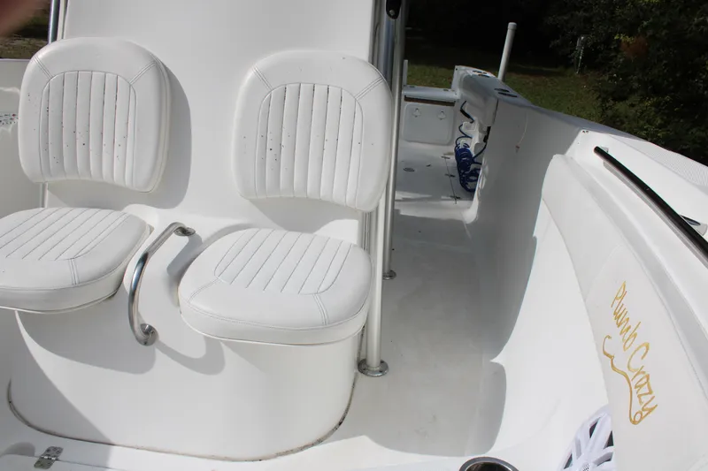 Slide: The Image of 2009 Sea Fox 256CC Pro Series boat interior with white seating. - 25