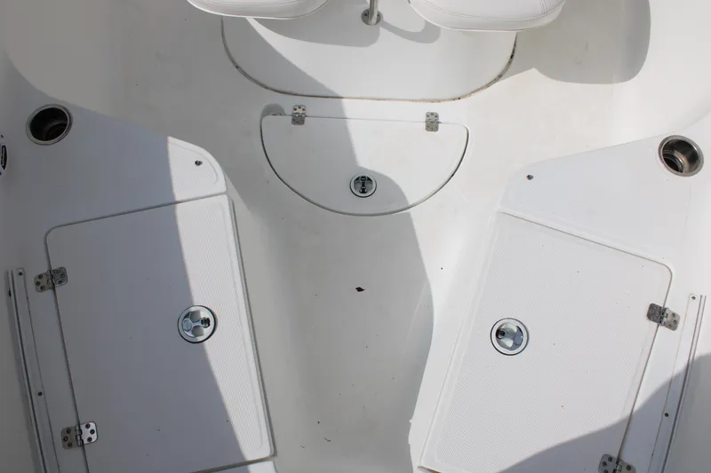 Slide: The Image of 2009 Sea Fox 256CC Pro Series boat deck with storage compartments. - 27