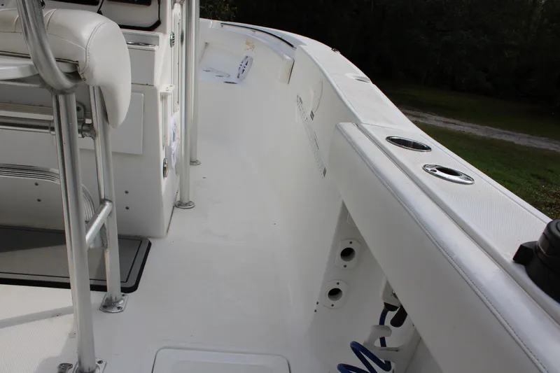 Slide: The Image of 2009 Sea Fox 256CC Pro Series boat interior, featuring white deck and seating. - 5
