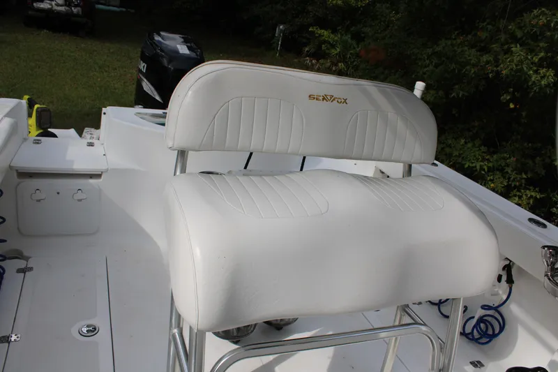 Slide: The Image of White seating on 2009 Sea Fox 256CC Pro Series boat deck. - 6