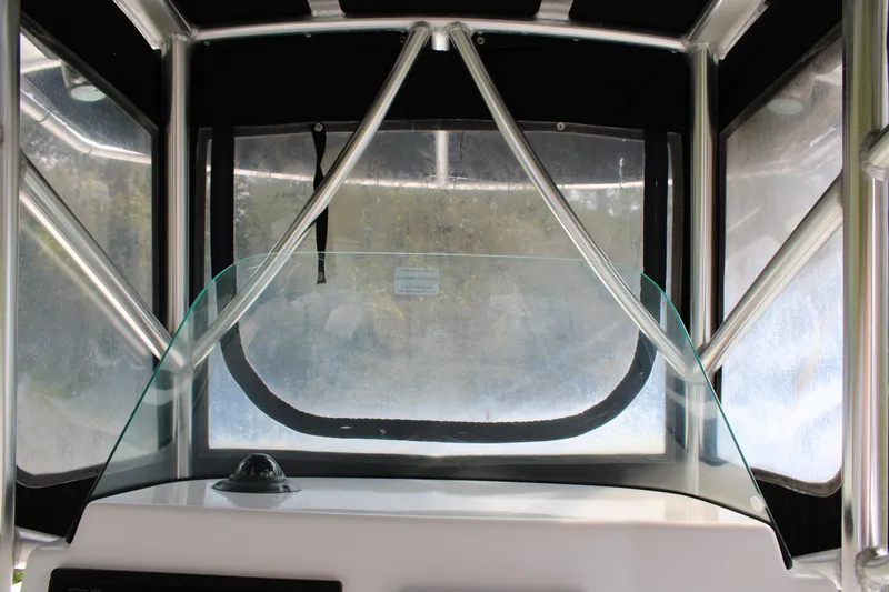 Slide: The Image of 2009 Sea Fox 256CC Pro Series boat interior with windshield and metal frame. - 7