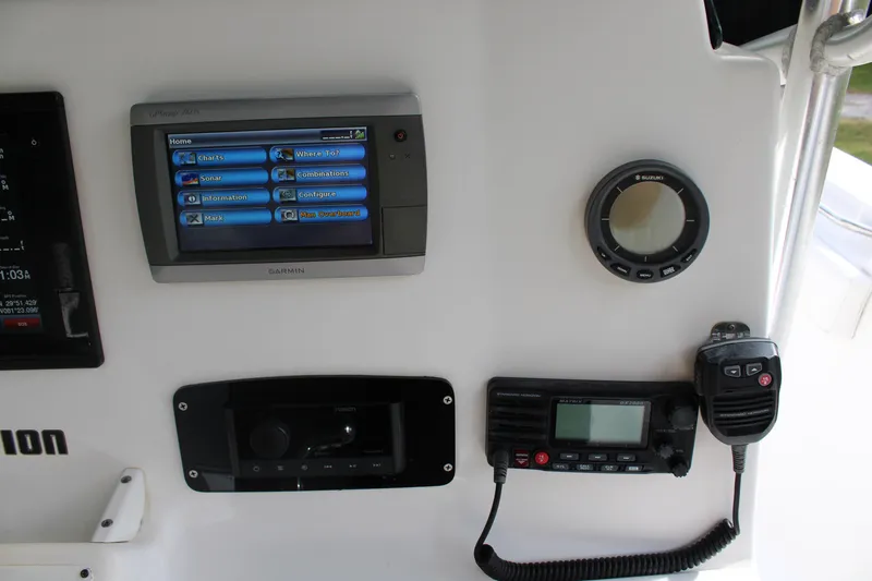Slide: The Image of Dashboard of 2009 Sea Fox 256CC Pro Series with navigation and communication equipment. - 9
