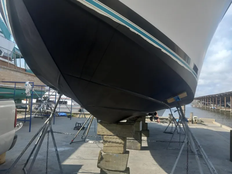 Slide: The Image of 1997 Bayliner 3255 Avanti boat on dry dock for maintenance. - 11
