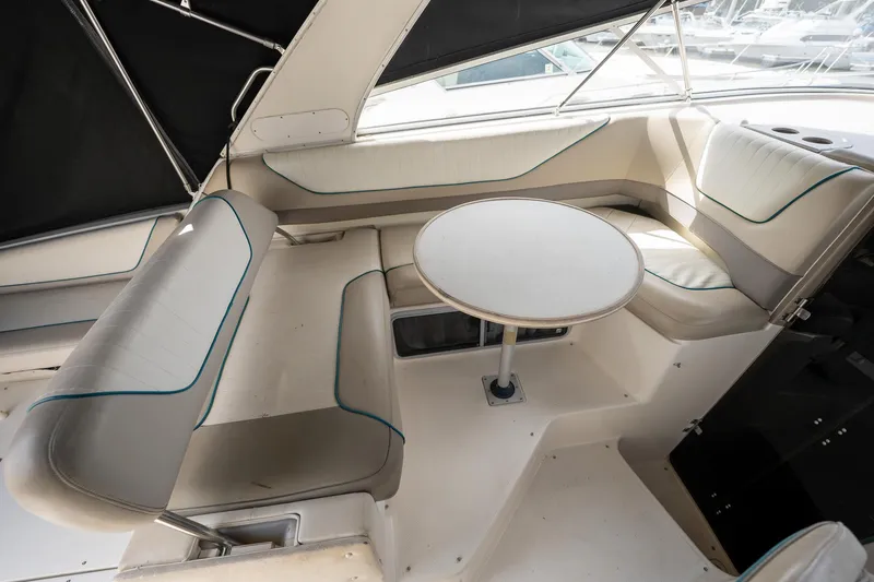 Slide: The Image of 1997 Bayliner 3255 Avanti boat interior with seating and table. - 21