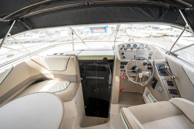Slide: The Image of 1997 Bayliner 3255 Avanti boat interior with steering wheel and dashboard. - 23