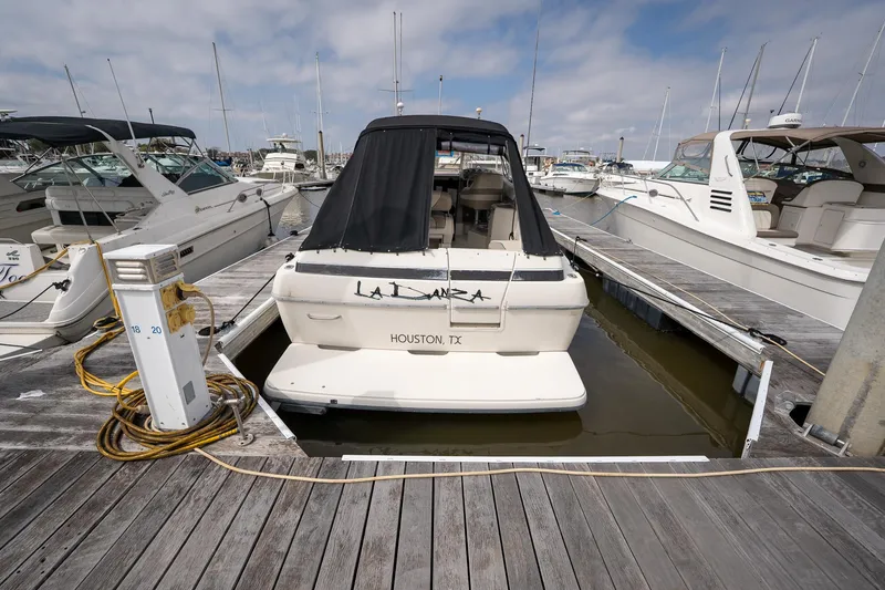 Slide: The Image of 1997 Bayliner 3255 Avanti docked at marina, rear view, Houston, TX. - 44
