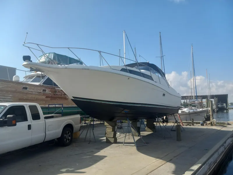 Slide: The Image of 1997 Bayliner 3255 Avanti boat on dry dock at marina. - 9