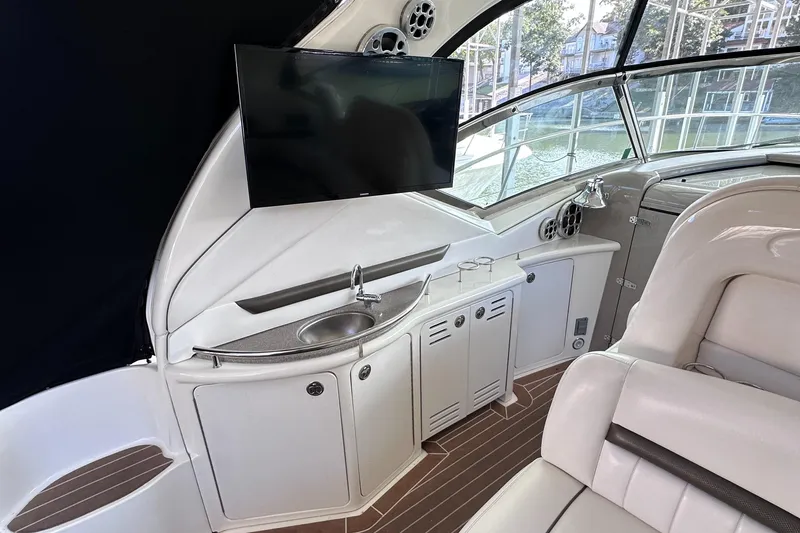 Slide: The Image of Luxurious 2007 Sea Ray 44 Sundancer yacht interior with TV and sink. - 18