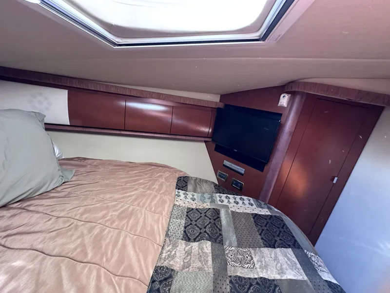 Slide: The Image of Interior cabin of 2007 Sea Ray 44 Sundancer with bed and TV. - 23