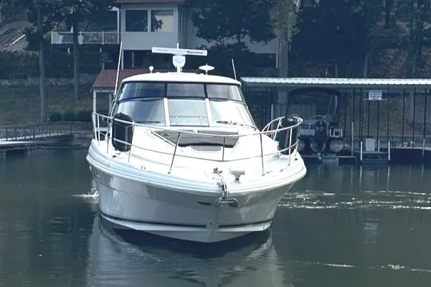 Slide: The Image of 2007 Sea Ray 44 Sundancer yacht docked on calm water. - 4