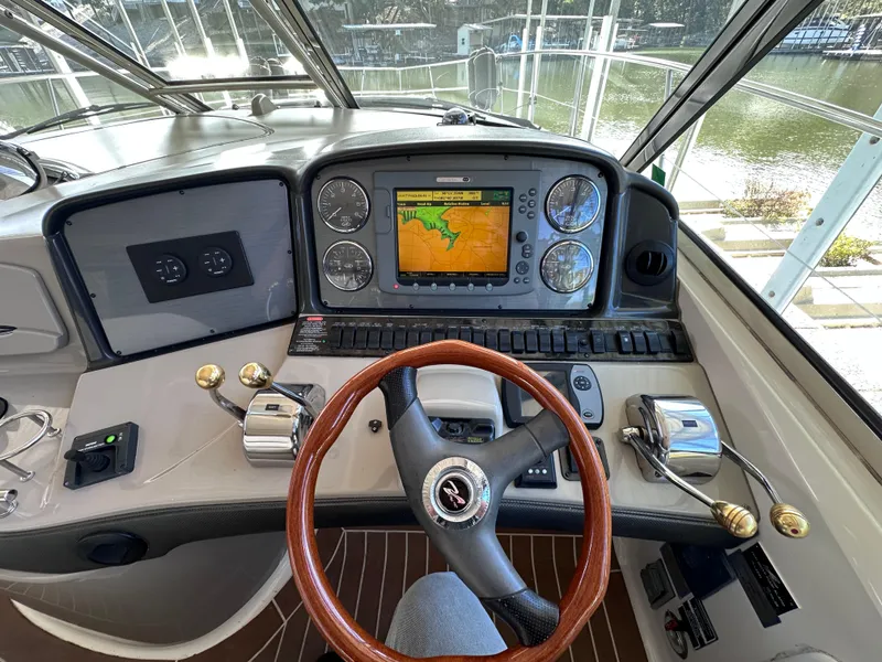 Slide: The Image of 2007 Sea Ray 44 Sundancer helm with navigation system and controls. - 8