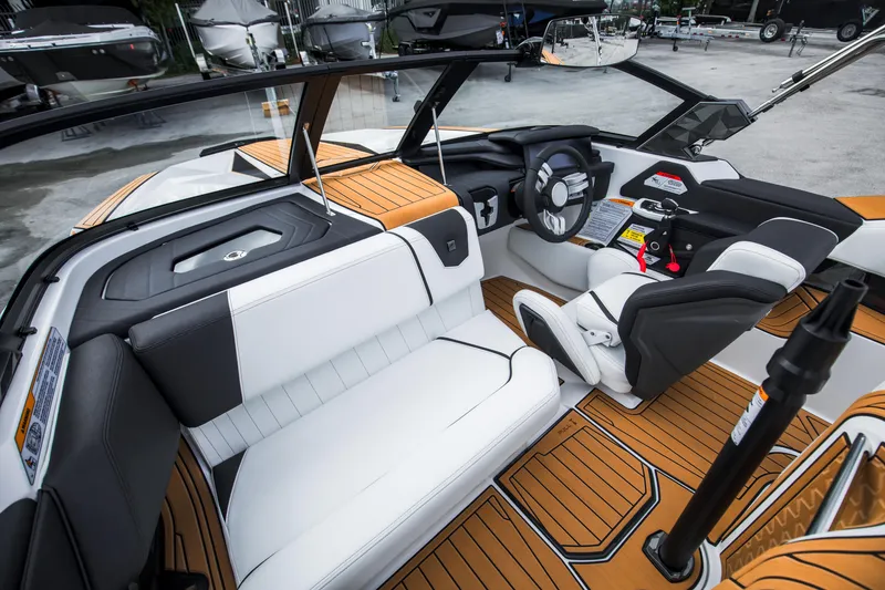 Slide: The Image of 2025 Nautique Ski boat interior with modern design and luxurious seating. - 16