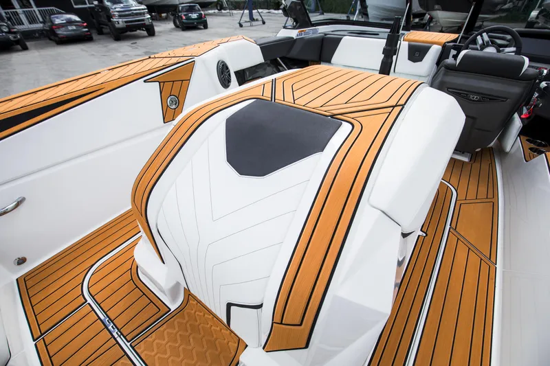 Slide: The Image of 2025 Nautique Ski boat interior with sleek, modern design and wood accents. - 24