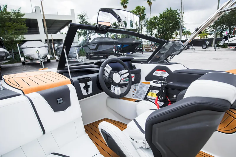 Slide: The Image of 2025 Nautique Ski boat interior with modern dashboard and seating. - 28