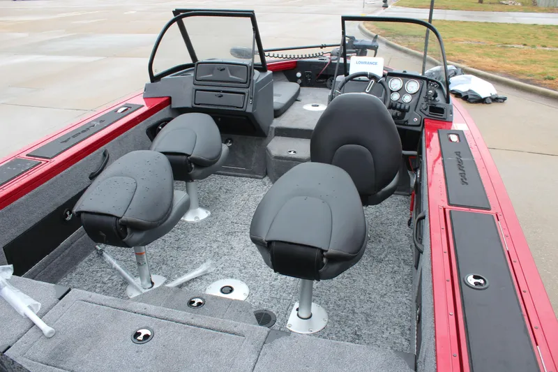 Slide: The Image of 2025 Tracker Targa V-18 Combo boat interior with seating and dashboard. - 10