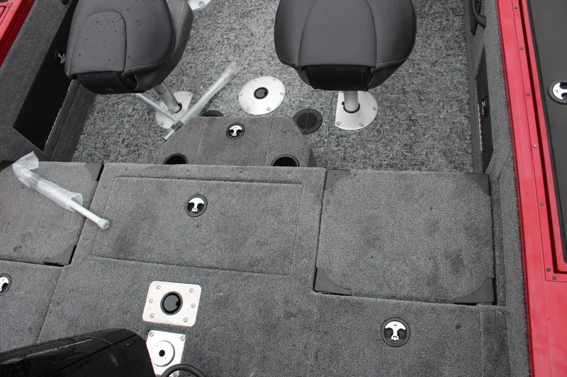 Slide: The Image of 2025 Tracker Targa V-18 Combo boat interior with gray carpet and seating. - 11
