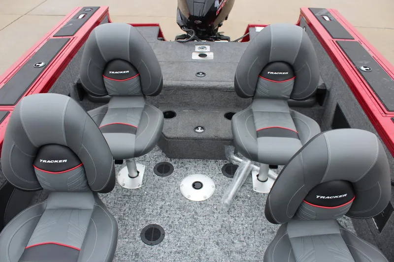 Slide: The Image of 2025 Tracker Targa V-18 Combo boat interior with four gray seats. - 12