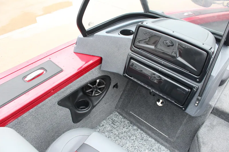 Slide: The Image of 2025 Tracker Targa V-18 Combo boat interior with storage compartments and speaker. - 14
