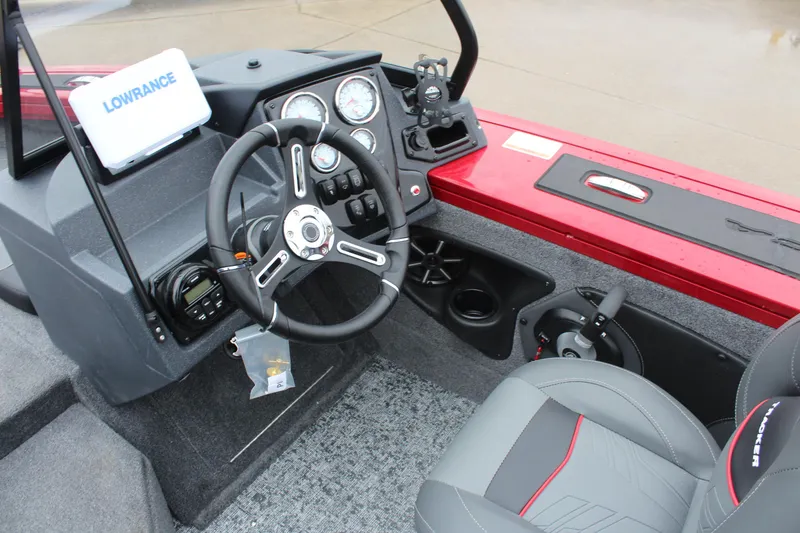 Slide: The Image of 2025 Tracker Targa V-18 Combo boat interior with steering wheel and control panel. - 15