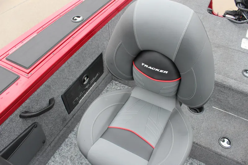 Slide: The Image of 2025 Tracker Targa V-18 Combo boat seat with gray upholstery and red accents. - 16