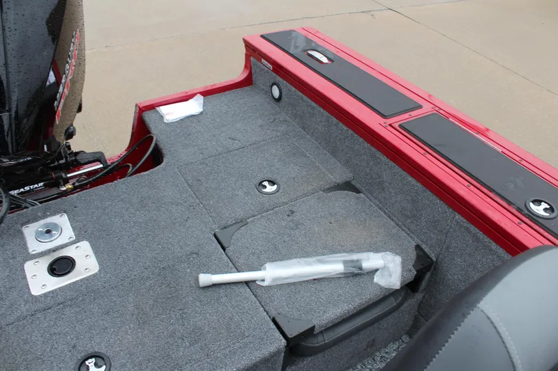 Slide: The Image of 2025 Tracker Targa V-18 Combo boat interior with storage compartments and seating. - 18