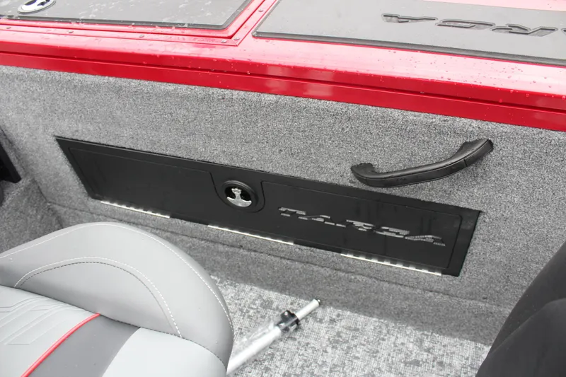 Slide: The Image of 2025 Tracker Targa V-18 Combo interior with storage compartment and seating. - 20