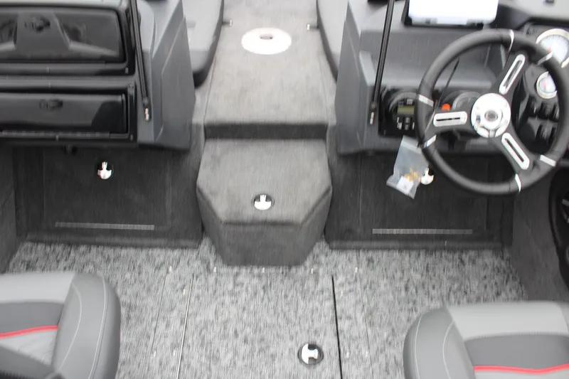 Slide: The Image of 2025 Tracker Targa V-18 Combo boat interior with steering wheel and seating. - 21