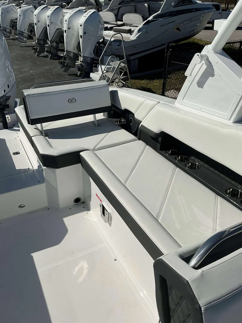 Slide: The Image of 2025 Cobalt R8 boat interior with white seating and cup holders. - 14