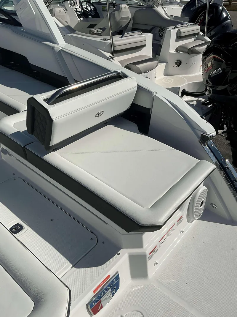 Slide: The Image of 2025 Cobalt R8 boat interior with sleek white seating and modern design. - 16