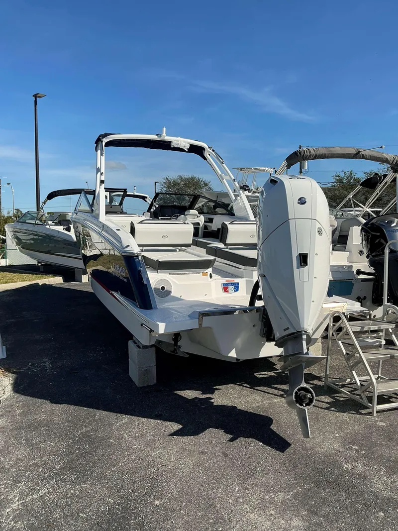 Slide: The Image of 2025 Cobalt R8 boat with outboard motor, parked on a sunny day. - 3